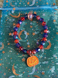 Stretchy Glass Dark Blue and Orange Beaded- Orange Smiling Pumpkin
