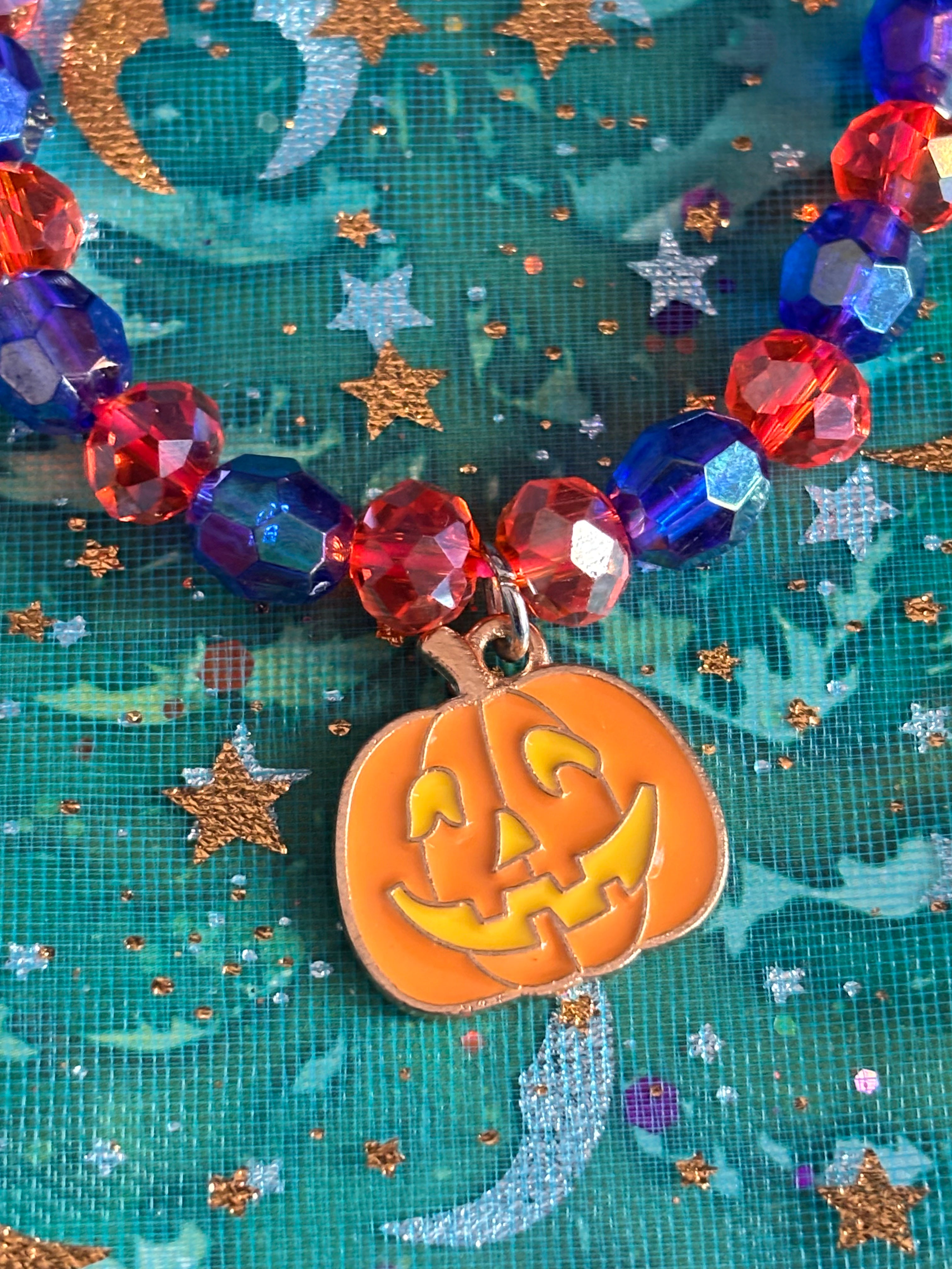 Stretchy Glass Dark Blue and Orange Beaded- Orange Smiling Pumpkin